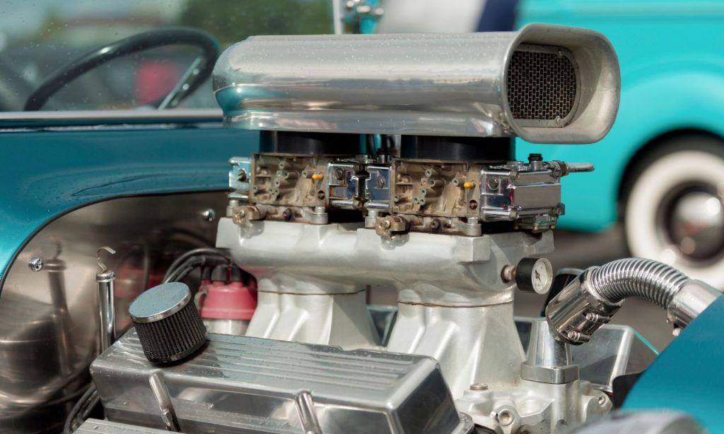 "what causes carburetor to backfire "